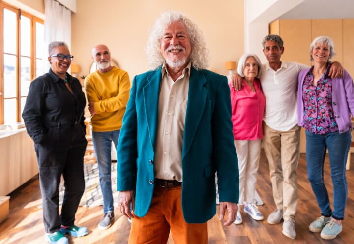 Group of Seniors Smiling inside Assisted Living Facility Group of Seniors Smiling inside Assisted Living Facility