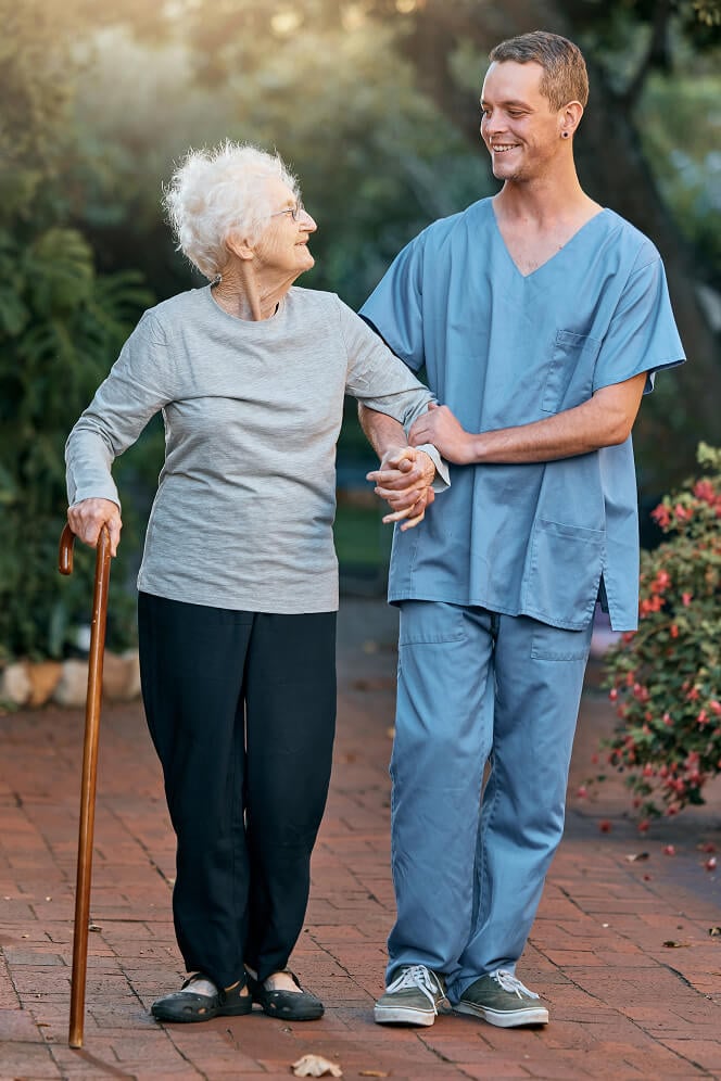 Nurse Comforting Elderly Woman at Nursing Home Oxford